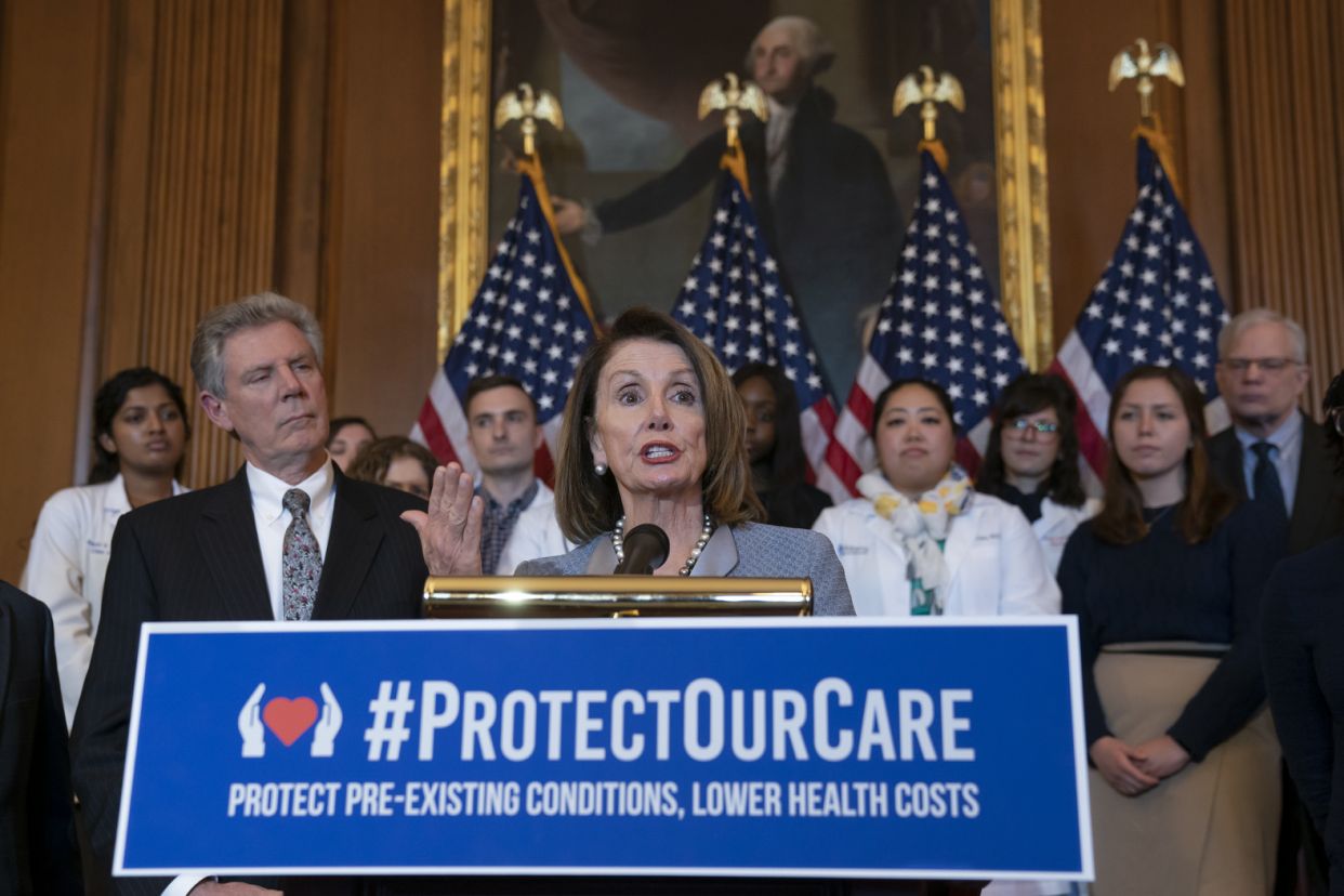 House Speaker Nancy Pelosi, joined at left by Energy and Commerce Committee Chair Frank Pallone, D-N.J. (Photo: J. Scott Applewhite/AP)