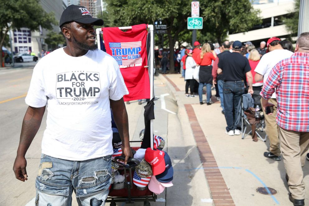 PHOTO: A vendor wears a campaign t-shirt that reads 