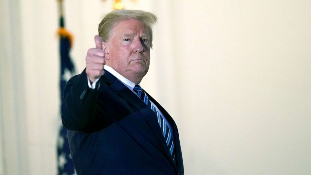 PHOTO: President Donald Trump gestures as he returns to the White House, Oct. 5, 2020, after leaving Walter Reed National Military Medical Center, in Bethesda, Md.