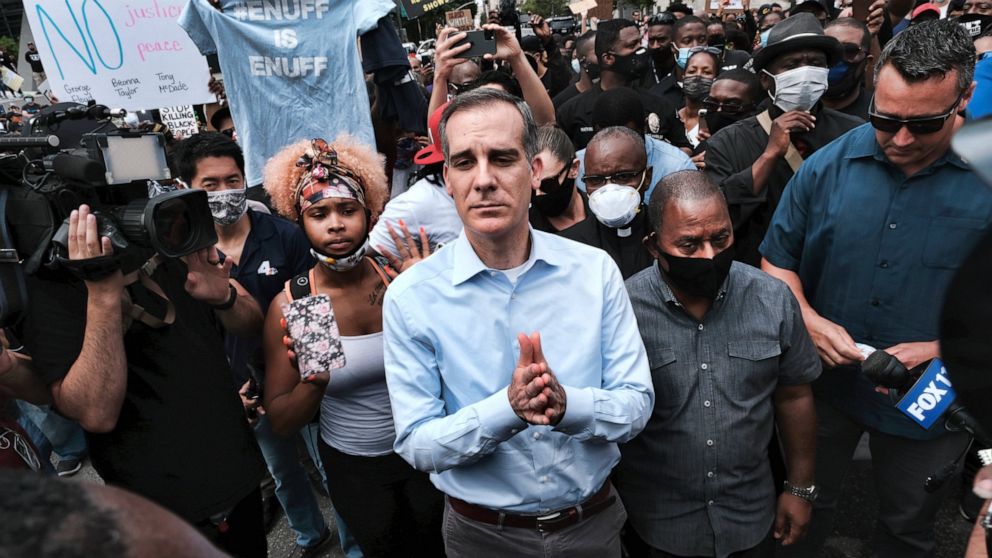 FILE - In this June 2, 2020, file photo, Los Angeles Mayor Eric Garcetti arrives to appeal to Black Lives Matter protesters in downtown Los Angeles. When Garcetti withdrew his support from District Attorney Jackie Lacey this week and endorsed her opp