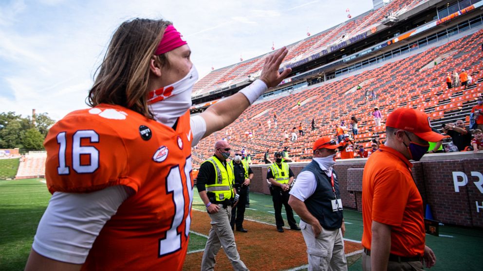 PHOTO: Clemson quarterback Trevor Lawrence waves to fans after their game against Syracuse at Memorial Stadium, Oct. 24, 2020.