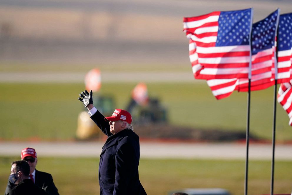 PHOTO: President Donald Trump waves to supporters after speaking at a campaign rally at Dubuque Regional Airport, Nov. 1, 2020, in Dubuque, Iowa.