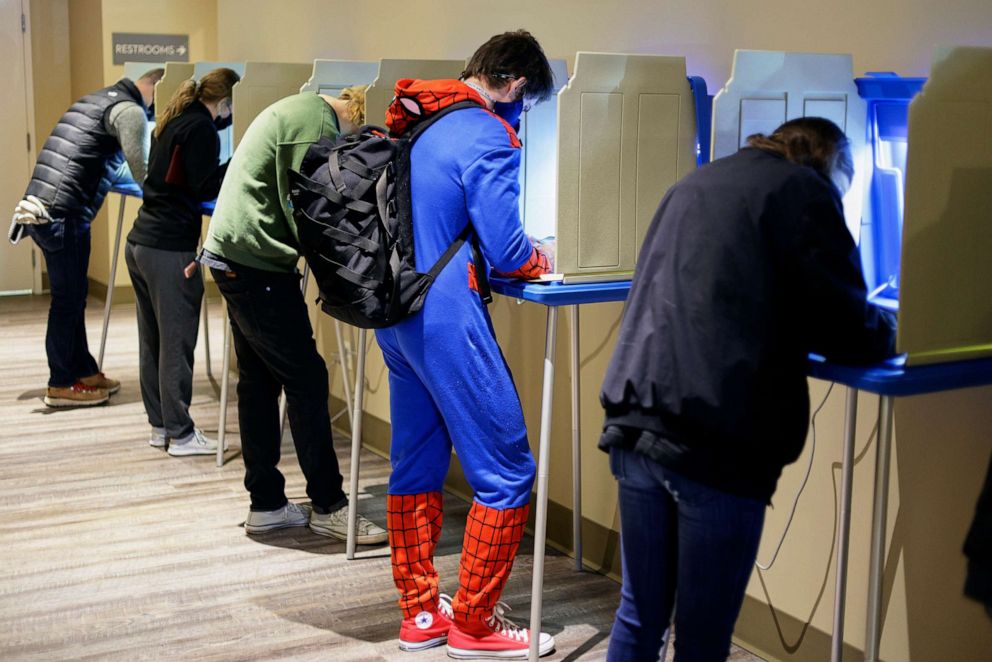 PHOTO: Colin Buckley of Omaha wears a Spiderman suit as he votes early on Halloween, at the Douglas County Election Commision office in Omaha, Neb., Oct. 31, 2020.