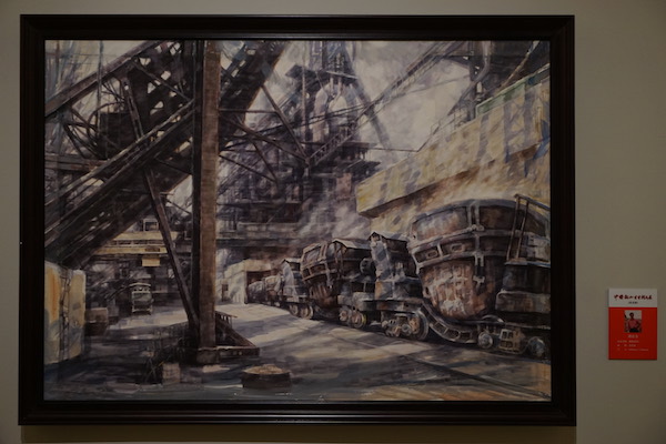  现场展出的描述后工业时代东北倾颓、废弃工厂场景的书画作品