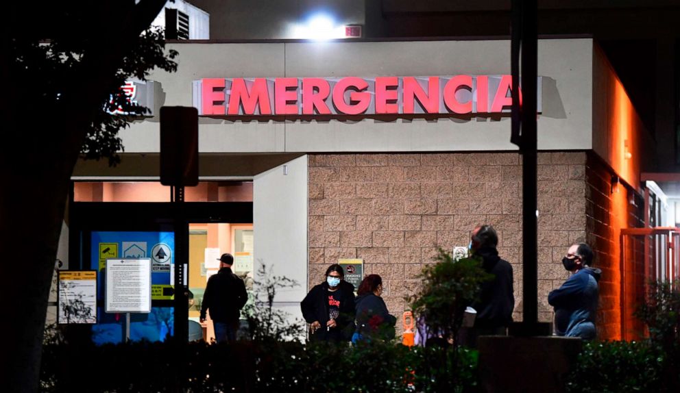 PHOTO: People wait outside the emergency room of the Garfield Medical Center in Monterey Park, California, on Dec. 1, 2020.