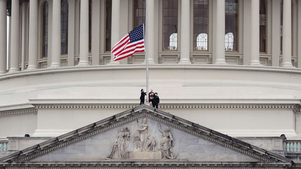 PHOTO: The American flag is lowered to half-staff atop the U.S. Capitol Building following the death of a U.S. Capitol Police Officer, Jan. 8, 2021, in Washington, D.C.