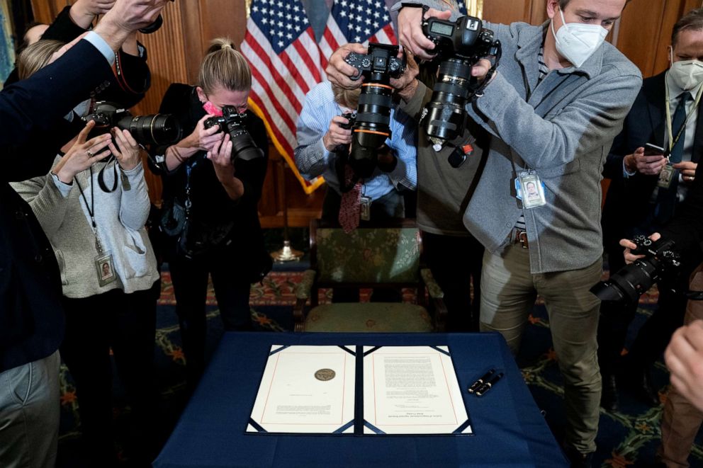 PHOTO: Photographers take pictures of the article of impeachment against President Donald Trump prior to it being signed at the U.S. Capitol on Jan. 13, 2021, in Washington, D.C.