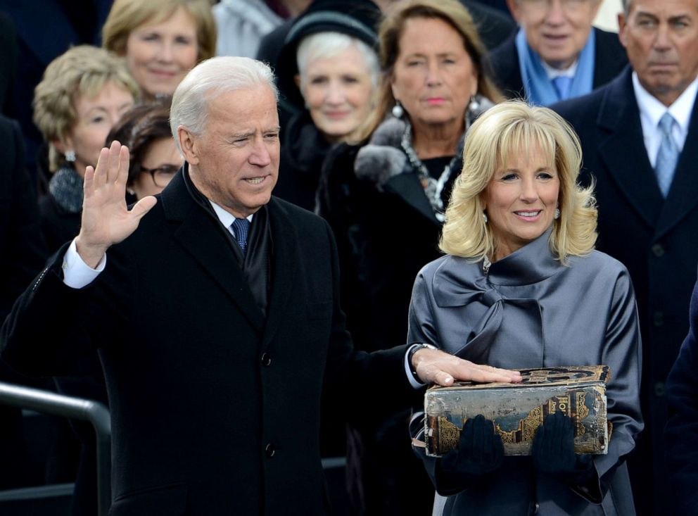 PHOTO: Joe Biden is sworn-in as Vice President, alongside his wife Jill who holds the family Bible during the 57th Presidential Inauguration ceremonial swearing-in at the US Capitol, Jan. 21, 2013, in Washington, D.C.