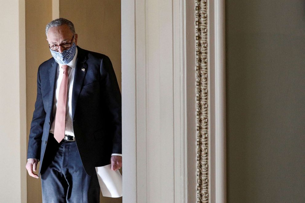 PHOTO: Senate Majority Leader Chuck Schumer, D-N.Y., exits his office on his way to a photo op with freshman senators at the U.S. Capitol in Washington, Jan. 21, 2021.