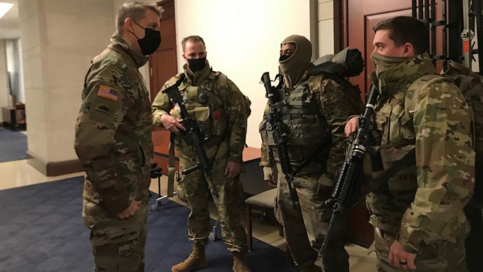 PHOTO: Gen. Daniel Hokanson, left, Chief of the National Guard Bureau, meets with guardsmen at the U.S. Capitol on Jan. 23, 2021.