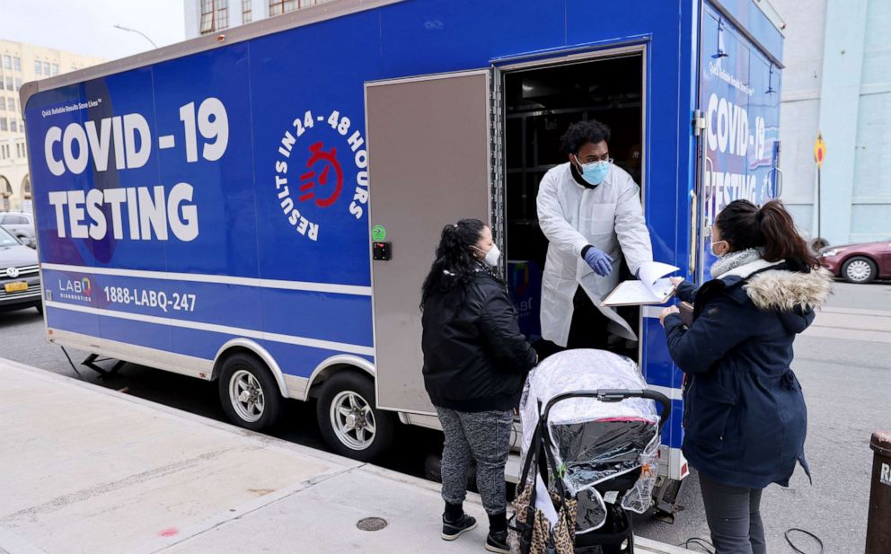 PHOTO: A medical worker stands outside of a mobile COVID-19 testing lab in Brooklyn borough of New York, Jan. 22, 2021.