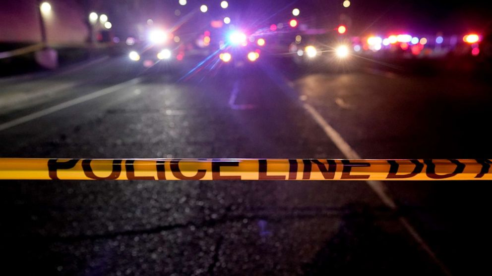 PHOTO: A police tape blocks a road near the scene where a Sacramento County Sheriff's deputy was shot and a suspect was shot and killed in the Sacramento suburb of Carmichael, Calif., Friday, Jan. 15, 2021. 