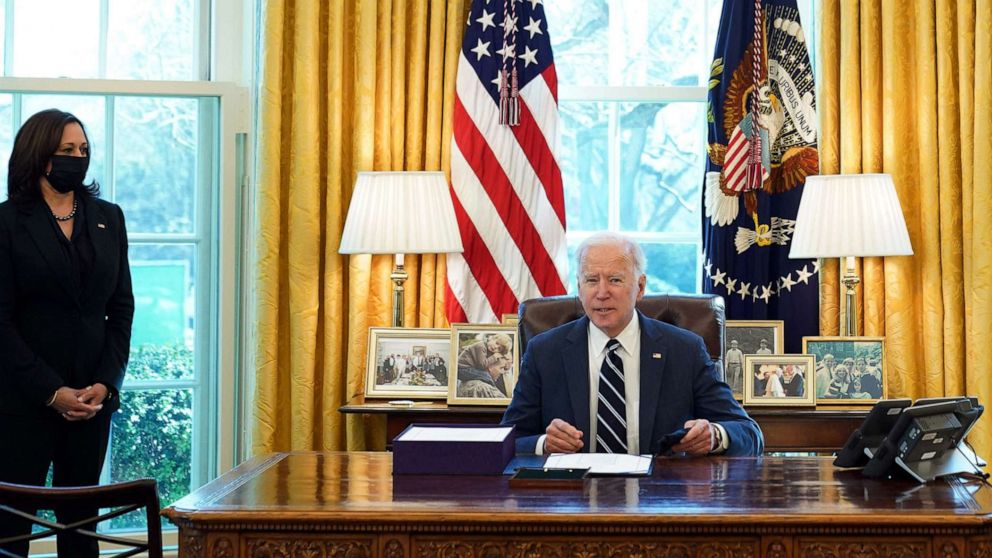 PHOTO: President Joe Biden signs the American Rescue Plan on March 11, 2021, in the Oval Office of the White House in Washington, D.C.  