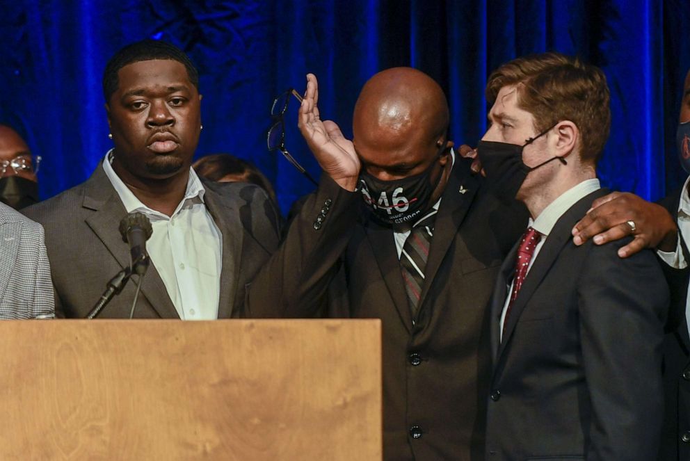 PHOTO: George Floyd's brother, Philonise Floyd, puts his arm around Minneapolis Mayor Jacob Frey as George Floyd's nephew Brandon Williams looks on during a press conference in Minneapolis, March 12, 2021.