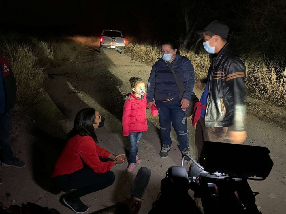 PHOTO: Rachel Scott speaks with a mother after she stepped onto U.S. soil with her five-year-old daughter along the U.S.-Mexican border, March 26, 2021.