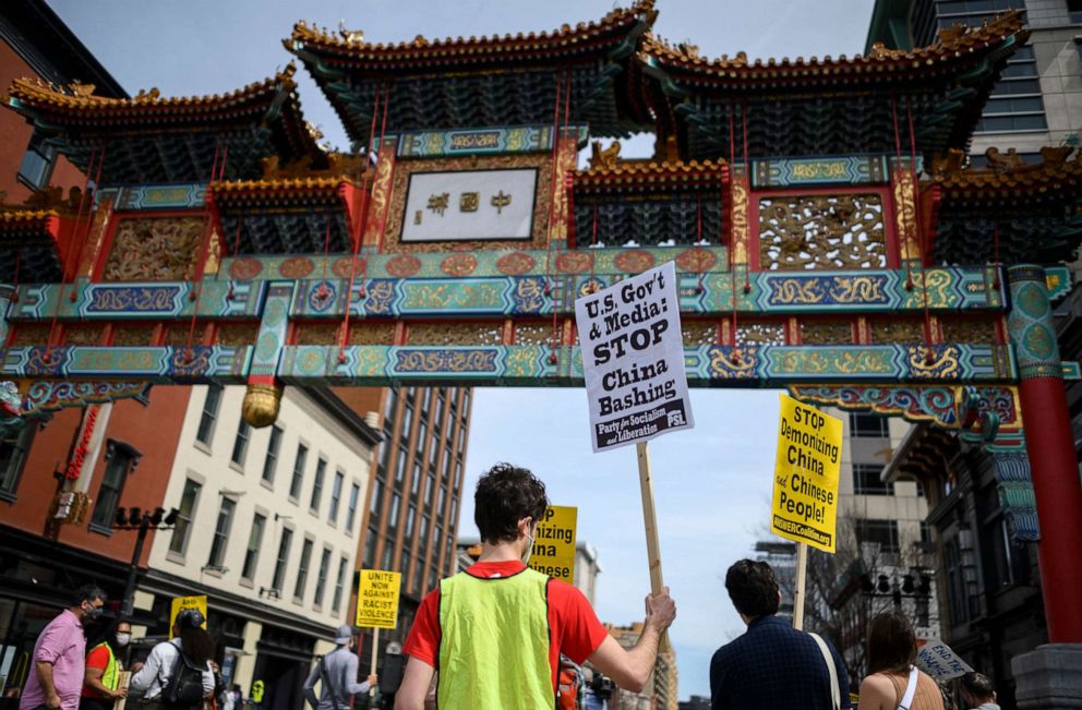 PHOTO: People participate in an 'Anti Asian Hate' rally in Chinatown in Washington, DC on March 27, 2021.
