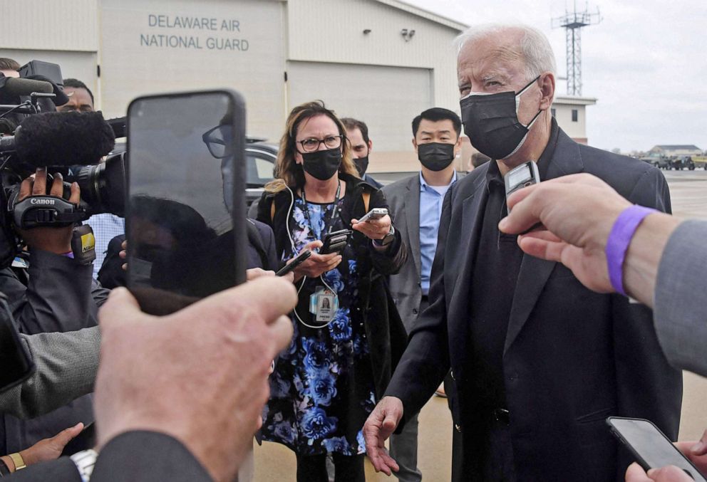 PHOTO: President Joe Biden speaks to the press before boarding Air Force One at New Castle airport in New Castle, Del., March 28, 2021. 