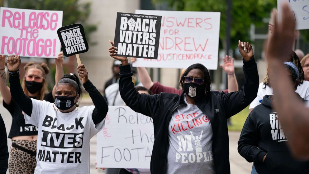 PHOTO: Demonstrators hold signs during a protest march, April 24, 2021, in Elizabeth City, N.C., calling for the release of body camera footage from the shooting death of Andrew Brown Jr., 3 days prior.