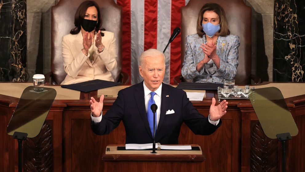 PHOTO: President Joe Biden addresses a joint session of congress as Vice President Kamala Harris and Speaker of the House Rep. Nancy Pelosi watch in the House chamber of the U.S. Capitol, April 28, 2021, in Washington.