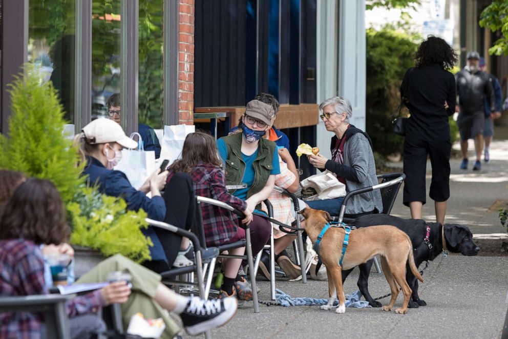 PHOTO: Customers enjoy outdoor dining at Cafe Umbria in Seattle's Ballard neighborhood, May 2, 2021. 