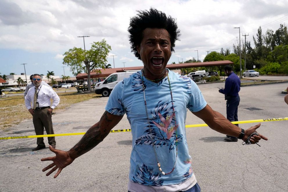 PHOTO: Clayton Dillard stands outside of the scene of a shooting at a banquet hall near Hialeah, Fla., as he seeks information about a family member, May 30, 2021.