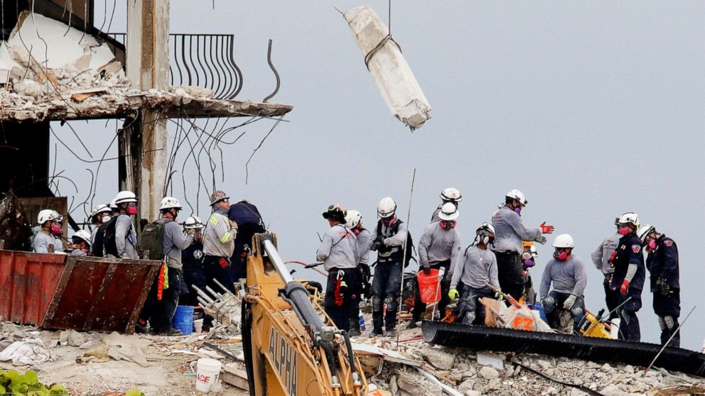PHOTO: Emergency workers conduct search and rescue efforts at the site of a partially collapsed residential building in Surfside, near Miami Beach, Fla., June 30, 2021.
