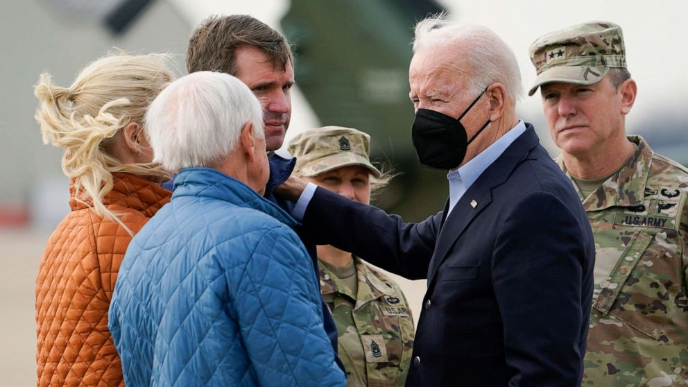 PHOTO: President Joe Biden greets Kentucky Gov. Andy Beshear and his wife Britainy Beshear as he arrives in Fort Campbell, Ky., Dec. 15, 2021, to survey storm damage from tornadoes and extreme weather. 