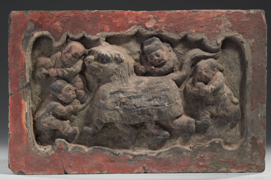 “社火”舞狮砖雕，金代（1115-1234），高23厘米，宽33厘米，厚4.5厘米，1981年山西省新绛县南范庄出土