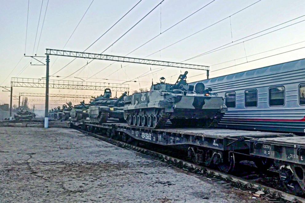 PHOTO: In this photo taken from video provided by the Russian Defense Ministry Press Service, Feb. 15, 2022, Russian armored vehicles are loaded onto railway platforms after the end of military drills in South Russia.