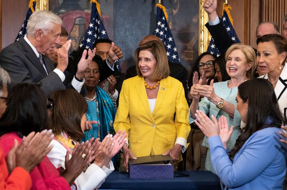 PHOTO: House Democrats applaud after Speaker of the House Nancy Pelosi signed the Inflation Reduction Act during a bill enrollment ceremony after the House passed the legislation at the U.S. Capitol, on Aug. 12, 2022, in Washington, D.C.