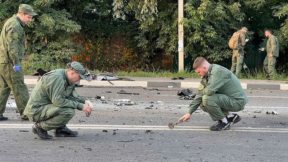 PHOTO: Investigators work on the site of explosion of a car driven by Daria Dugina outside Moscow, Aug. 21, 2022.