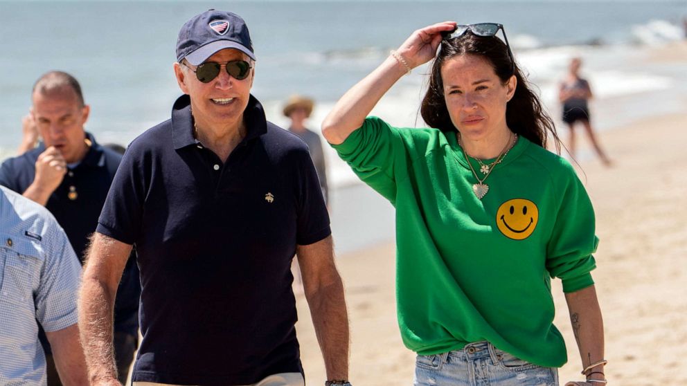 PHOTO: President Joe Biden walks on the beach with daughter Ashley Biden, in Rehoboth Beach, Del., June 20, 2022. 