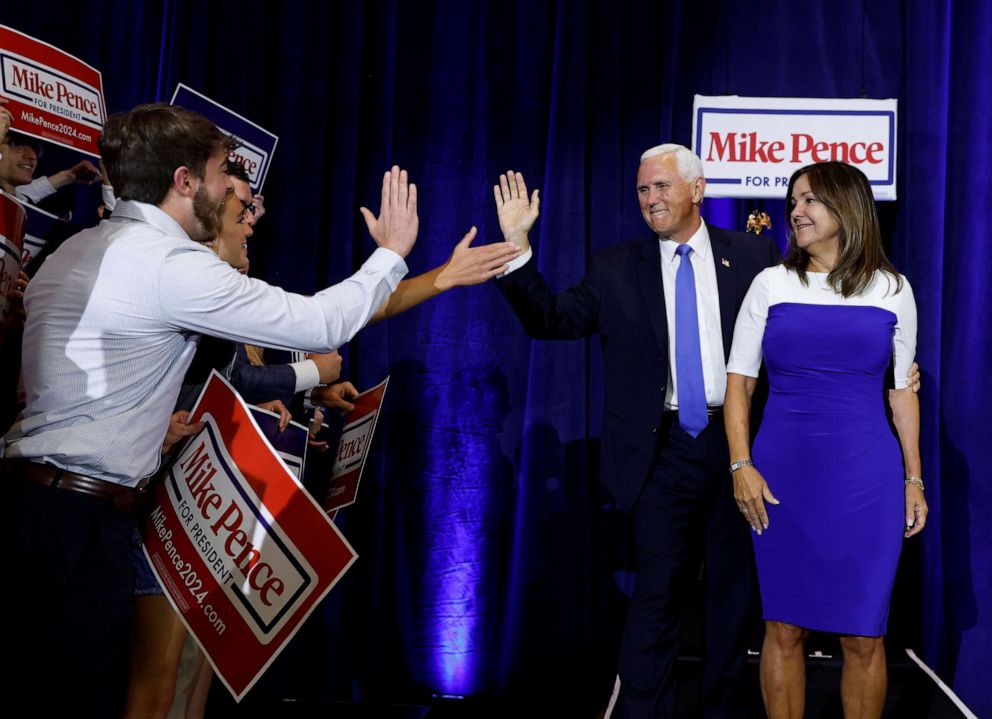 PHOTO: Former Vice President Mike Pence is greeted by supporters as he arrives with his wife Karen to make a U.S. presidential campaign announcement kicking off his race for the 2024 Republican presidential nomination in Ankeny, Iowa, June 7, 2023.