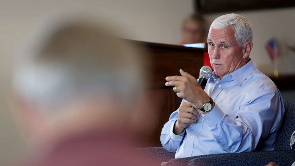 PHOTO: Former Vice president Mike Pence speaks with guests during a campaign stop he made with his wife Karen, July 6, 2023, in Holstein, Iowa.